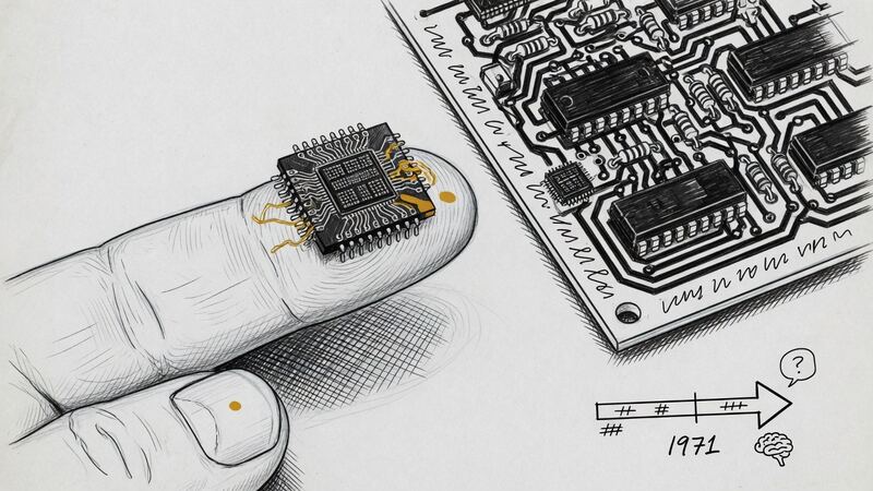 A small silicon chip on a fingertip next to a circuit board.